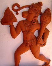Sculpture of Hanuman carrying the Dronagiri mountain, with a mace in his left hand